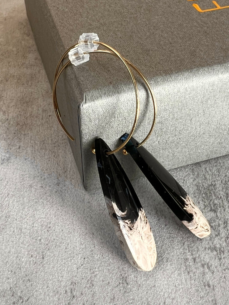 Palm Root stone on hoop earrings. Each stone has a unique natural patten and varies in color. These stones are about 2.5cm to 3.5 cm long and are very light, which makes them easy to wear. Every set of earrings are paired with hoops to match, please see main page for specifics.
