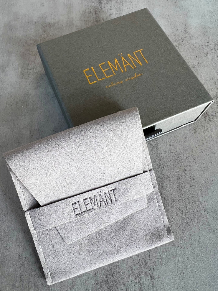 Each necklace arrives in a gray 4*4*1.5in (10*10*3.5cm) beautiful high quality and carefully designed pull out box with shiny embossed logo on front and instagram name on back. Inside is a 3.5*3.5in (9*9cm) lighter gray seude pouch with debossed logo on the band laying on top of a black soft cushion. Included in each box is a note describing the stone and it&