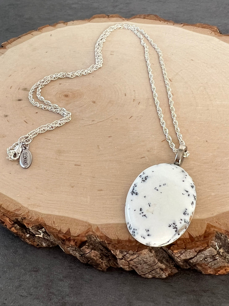 Opal necklace pendant on a long roped sterling silver chain and a small Elemant logo attached at the clasp.