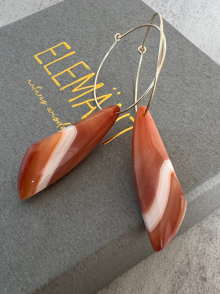 Carnelian stone on hoop earrings. Each stone has a unique natural patten and varies in color. These stones are about 2.5cm to 3.5 cm long and are very light, which makes them easy to wear. Every set of earrings are paired with hoops to match, please see main page for specifics.