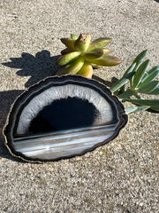 Black Agate pop socket (popsocket) for use with iphone, androids, ipads, and other small tecnical devices.  Used for easy grip of electronics as well as a beautiful phone accessory.  It is an attachment that easily tapes onto the back of the device and pops in and out as needed for use.  These agate slices are natural and pure agate stones imported from Brazil of the highest quality and beautifylly gold dipped on the rim. 
