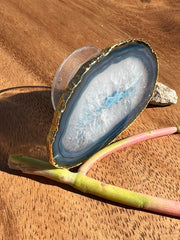 Blue Agate pop socket (popsocket) for use with iphone, androids, ipads, smartphones, and other small tecnical devices. Used for easy grip of electronics as well as a beautiful phone accessory. It is an attachment that easily tapes onto the back of the device and pops in and out as needed for use. These agate slices are natural and pure agate stones imported from Brazil of the highest quality and beautifylly gold dipped on the rim.